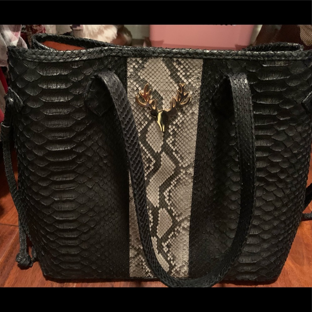 Taxidermy brand python handbag w dust bag. Like new, carried only once or twice.